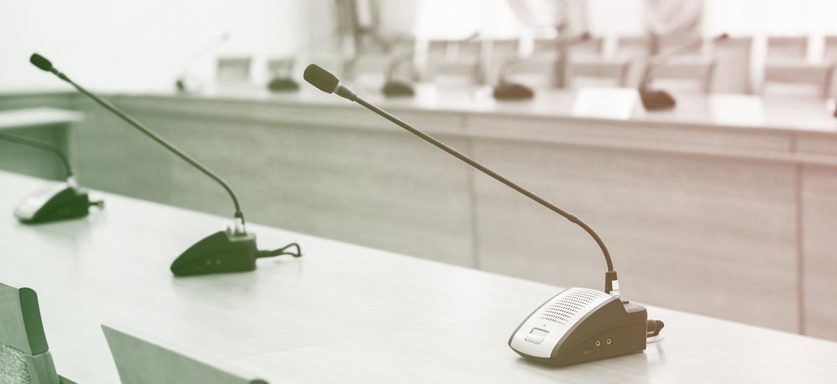 Desk microphones in a row.