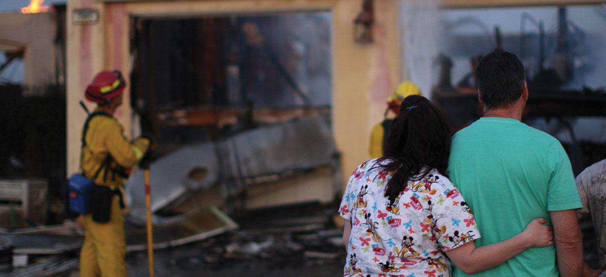 coupole looking at burned house