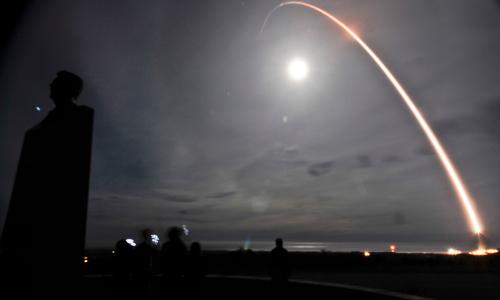 A missile being launched at night