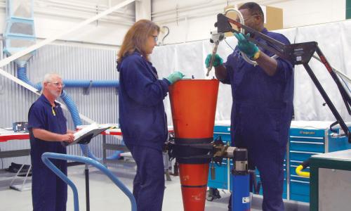 Pantex production technicians work on a W76 SLBM warhead