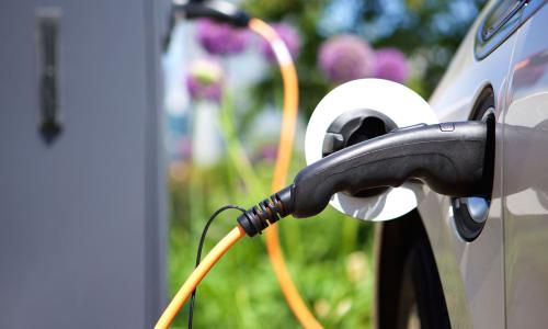 Electric car at charging station