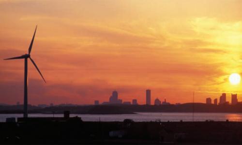 Wind turbine in Hull, MA at sunset