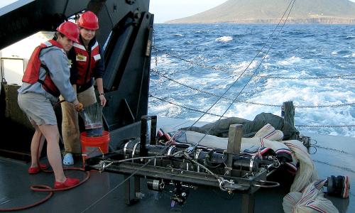 Two NOAA fisheries scientists on a research ship in the Virgin Islands