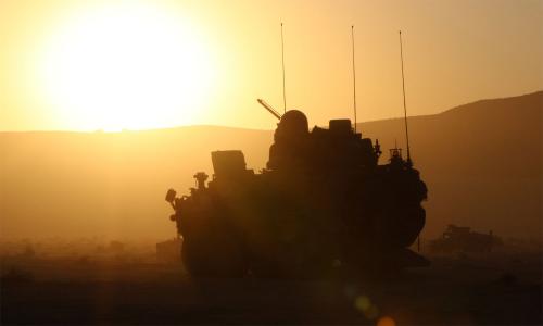 tank silhouette facing blazing sun