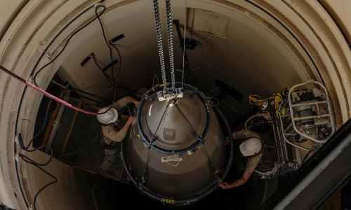 Airmen from the 90th Missile Maintenance Squadron prepare a reentry system for removal from a launch facility