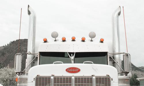 a Peterbilt semi truck with big exhaust pipes