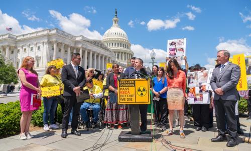 Advocates and members of Congress gather outside the House of Representatives