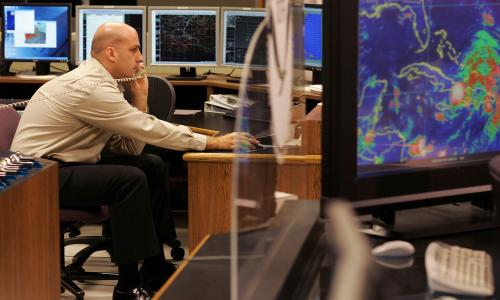 A meteorologist tracks a hurricane.