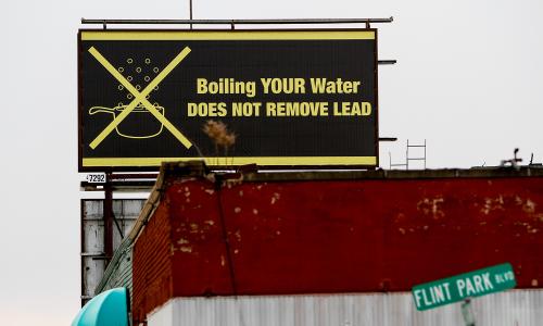 A billboard in Flint, Michigan, that reads "Boiling YOUR Water DOES NOT REMOVE LEAD"