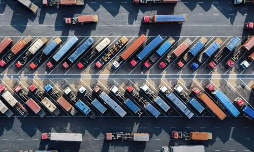 aerial view of dozens of semi trucks