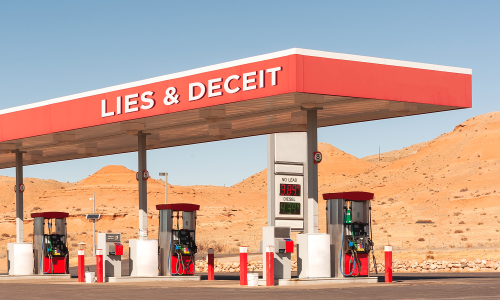 A gas station in a desert with a sign that says "Lies & Deceit."