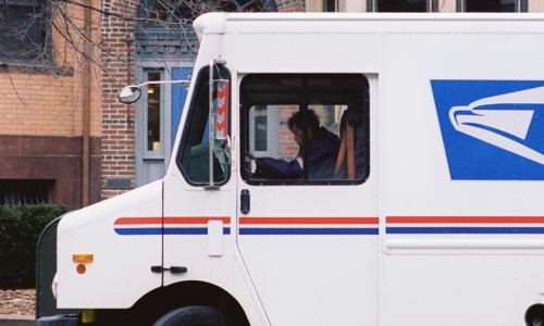 USPS truck delivering mail