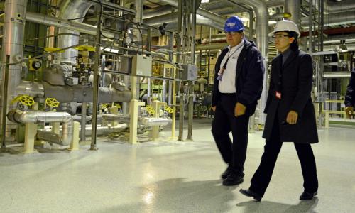 Regulators tour a plant