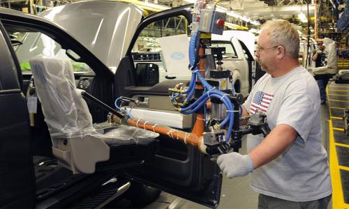 A worker at an automotive factory