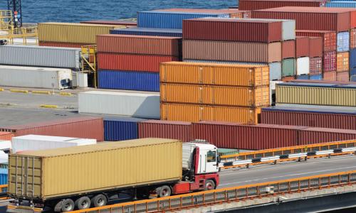 A truck with a storage container at a shipping port